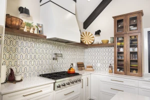 custom kitchen design feature open shelves and unique patterned backsplash