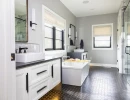 bathroom remodel with modern floors and cabinetry lighting