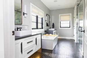 bathroom remodel with modern floors and cabinetry lighting