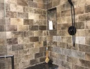 interior of bathroom shower with ornate hardware and materials