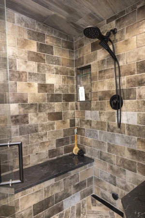 interior of bathroom shower with ornate hardware and materials