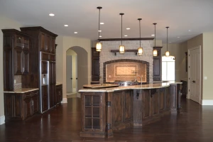 kitchen renovation featuring a unique built-in range with custom stonework