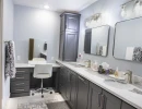 modern bathroom remodel featuring custom countertops and vanity