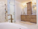 bathroom remodel with soaker tub and custom cabinets