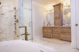 bathroom remodel with soaker tub and custom cabinets