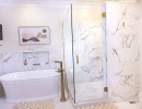 soaker tub and shower remodel with tv and built-in storage