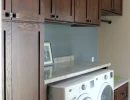 laundry room remodel with folding counter and storage