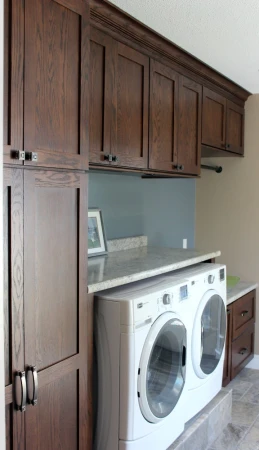 laundry room remodel with folding counter and storage