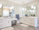 bath remodel with large counterspace and built-in makup vanity