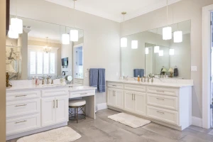 bath remodel with large counterspace and built-in makup vanity