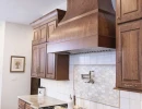 custom kitchen hood and ornate backsplash