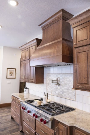 custom kitchen hood and ornate backsplash