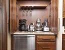 custom bar cabinetry with built-in fridge