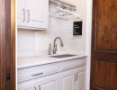 laundry room with custom flooring and utility sink