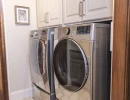 laundry room renovation with overhead storage