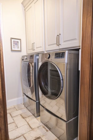 laundry room renovation with overhead storage